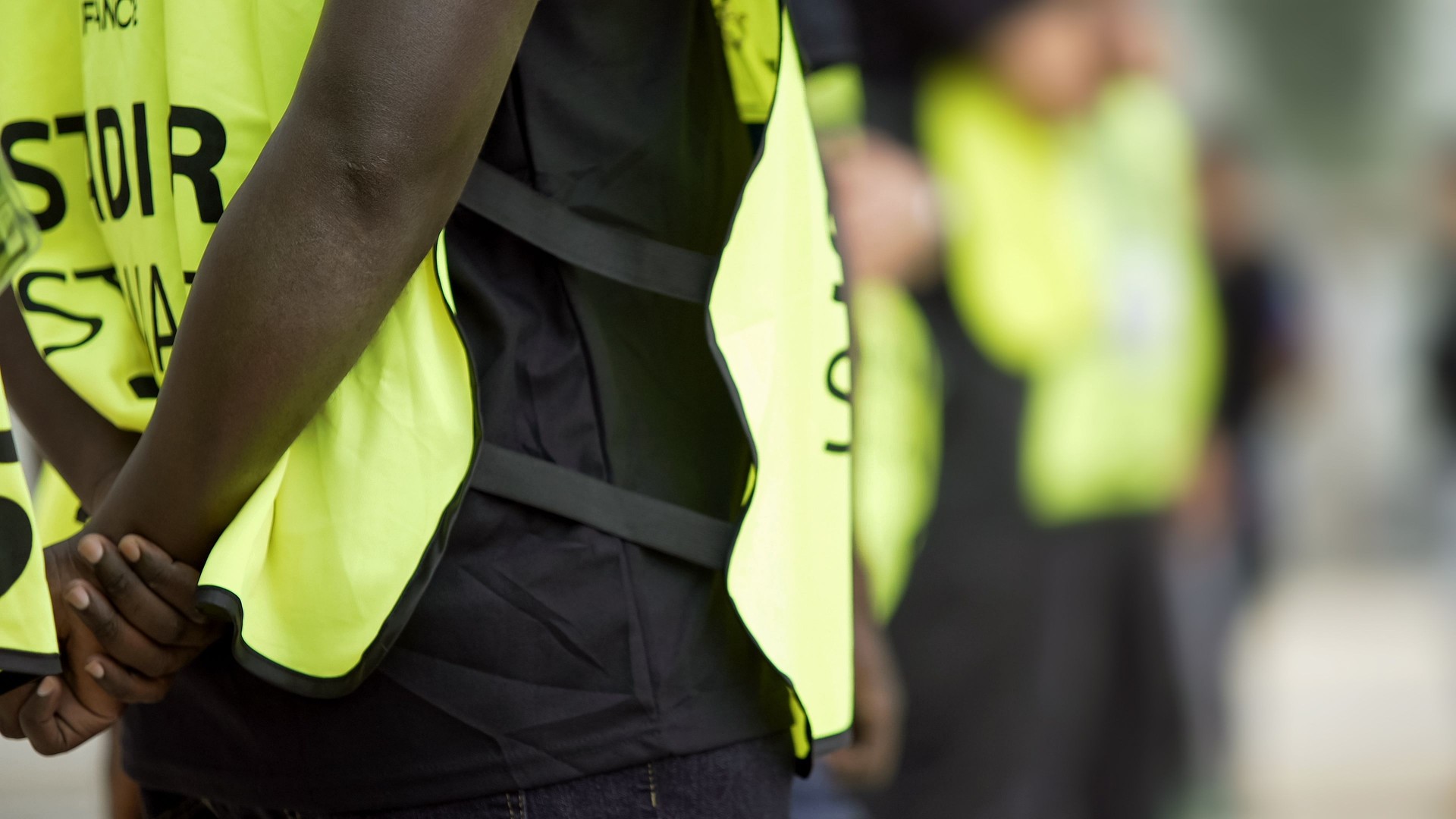 Stewards supervising and controlling security, safety measures at sports arena